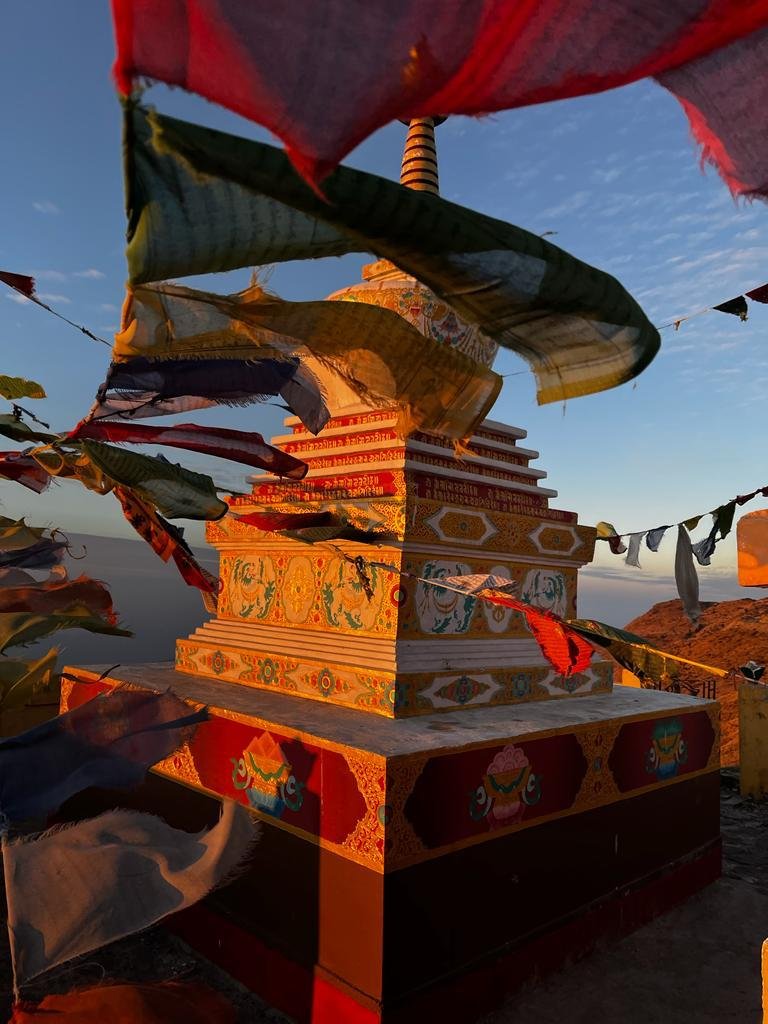 Sunset reflecting its color on a stupa in between Sandakphu-Phalut Trek